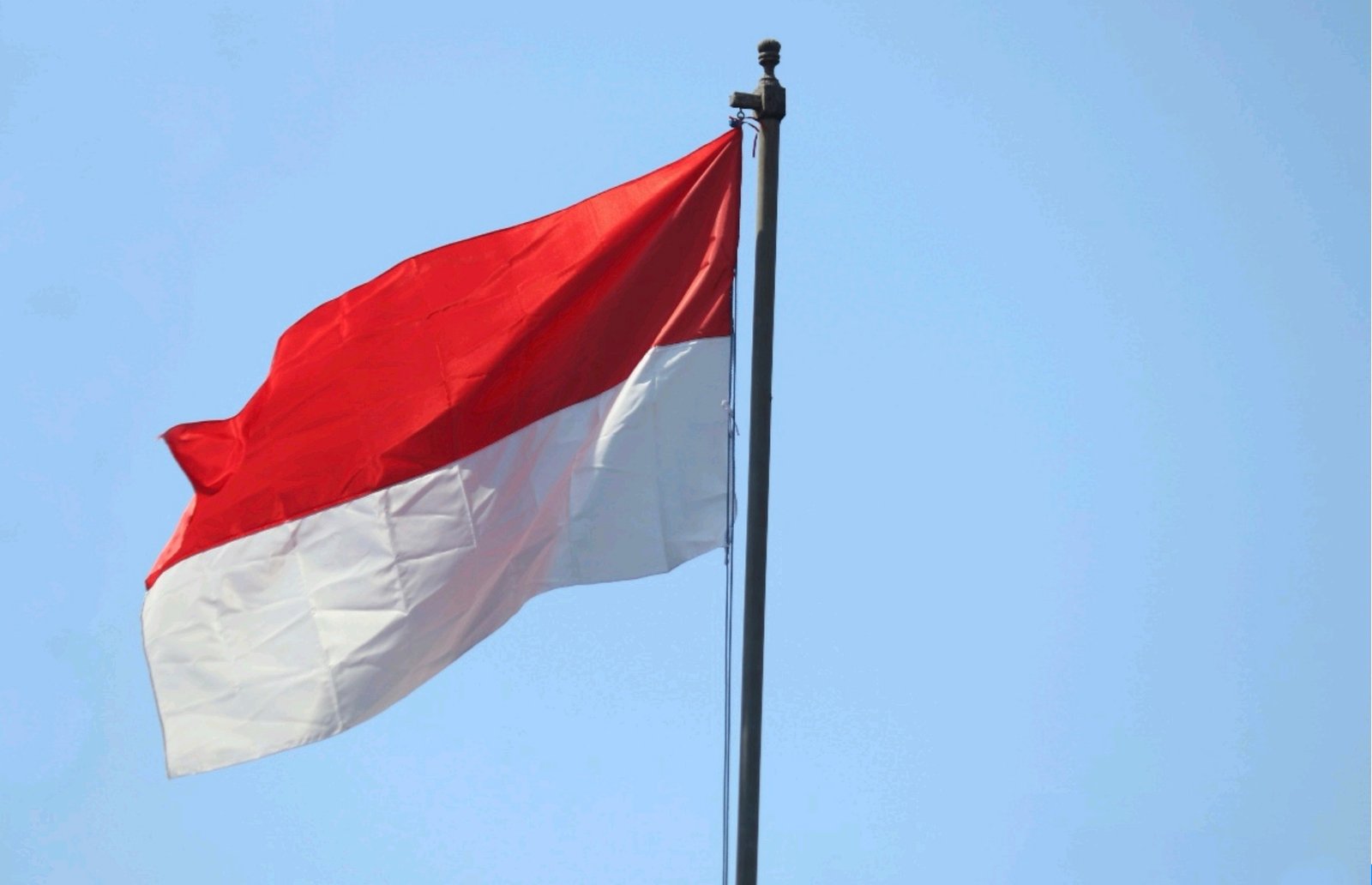 Illustrasi bendera Indonesia. Foto: (unsplash/mufid majnun)
